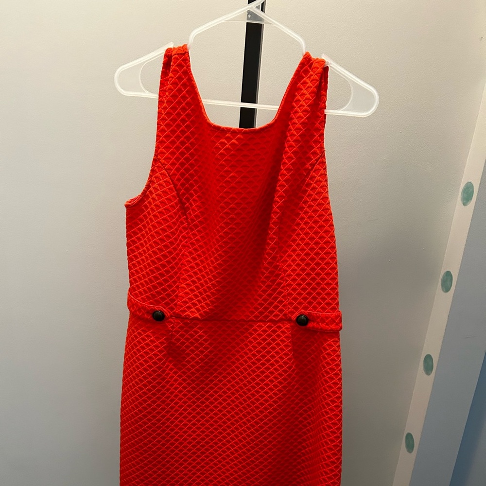 Cute orange sleeveless dress.